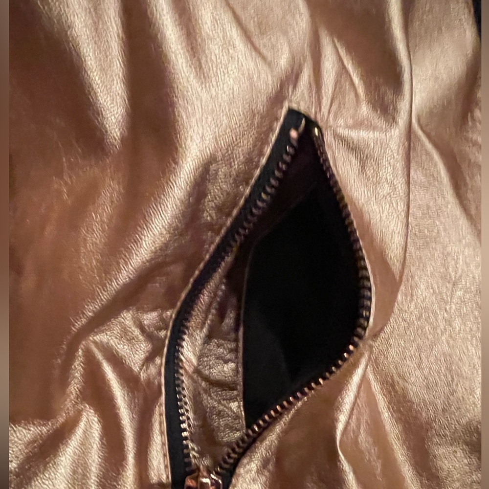 Rose Gold jacket ,there is also a little pocket on left arm .